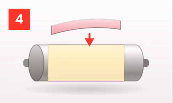 Printing plate being lowered onto the taped cylinder