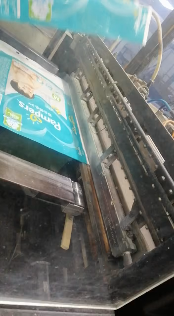 Heat sealer jaw covered with brown PTFE Cloth Tape so hot film does not bond to the metal.